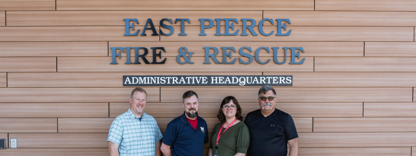 Four members of East Pierce Fire & Rescue's Chaplain Program stand outside the Administrative Headquarters building in Bonney Lake.
